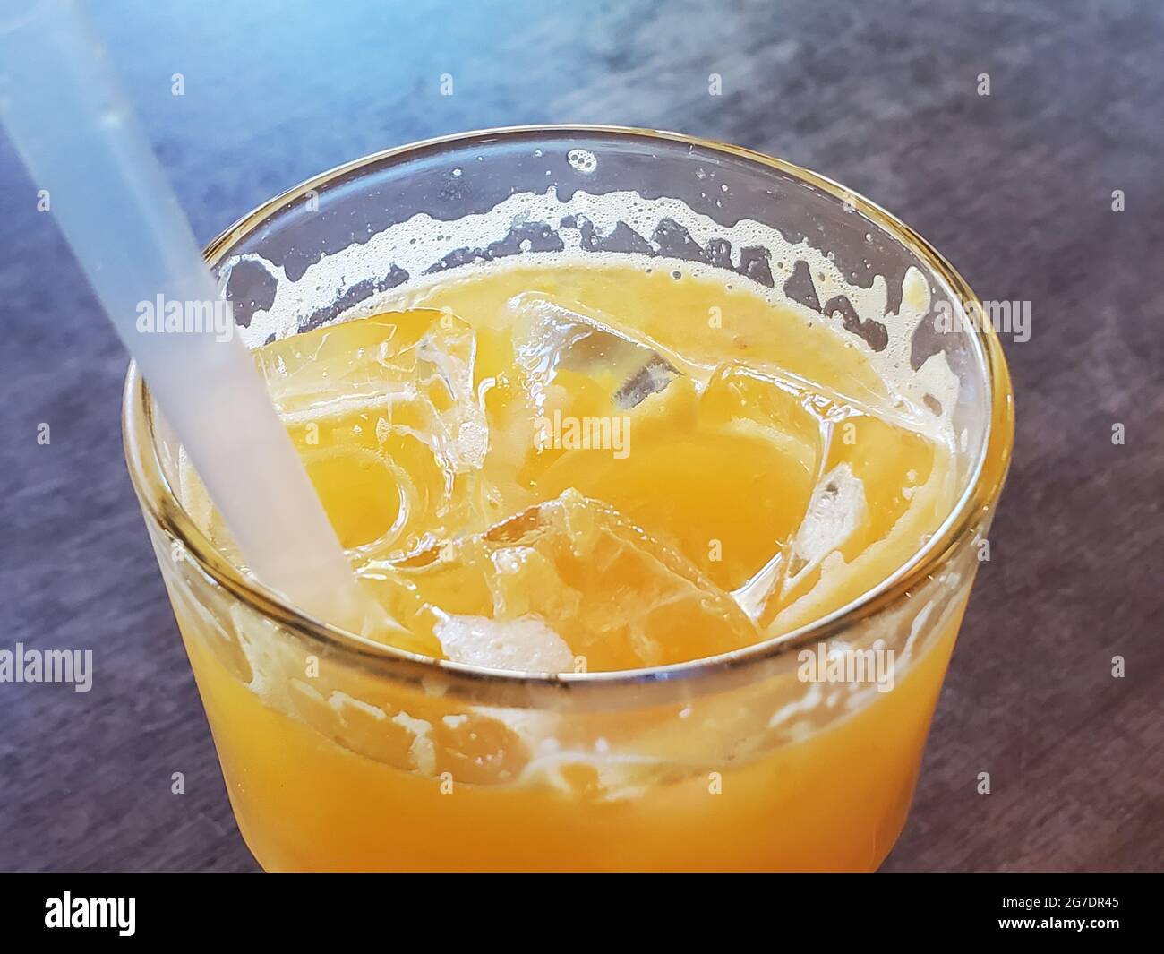 Close-up shot of orange juice with ice served in a glass with a straw, at Tutu's Food and Drink restaurant in Lafayette, California, May 4, 2021. () Stock Photo