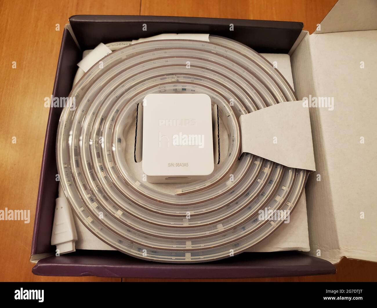 Coiled LED strip and power adaptor, part of the Philips Hue lightstrip product, in a smart home in Lafayette, California, May 5, 2021 Photo - Alamy