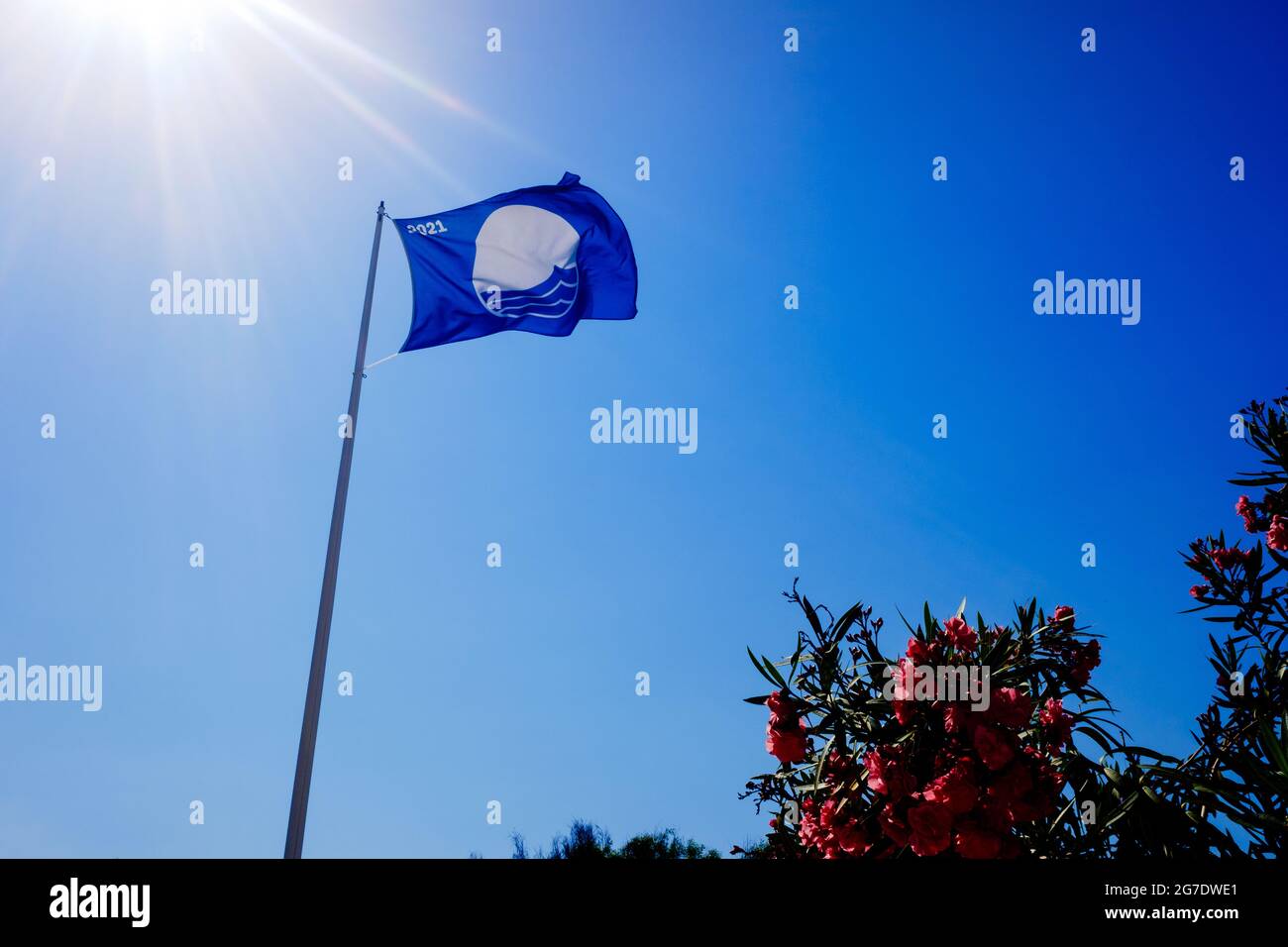 Valencia, Spain July 6, 2021 The blue flag is a badge that is awarded to the best beaches of