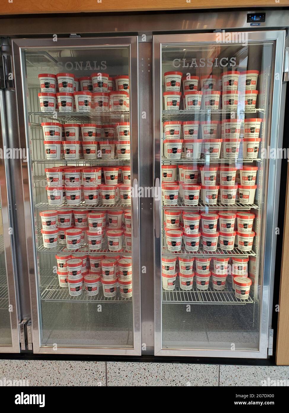 Pints of ice cream are visible in a freezer at Salt and Straw ice cream in San Ramon, California, May 17, 2021. () Stock Photo