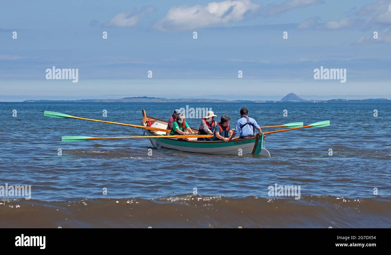 Portobello, Edinburgh, Scotland, UK weather. 13h July 2021. Hot and sunny afternoon at the seaside by the Firth of Forth. Temperature of just over 22 degrees centigrade. Credit: Scottishcreative/ Alamy Live News. Stock Photo