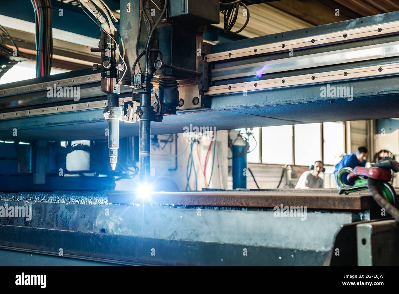 Plasma cutter in a factory cutting thick piece of metal Stock Photo Alamy