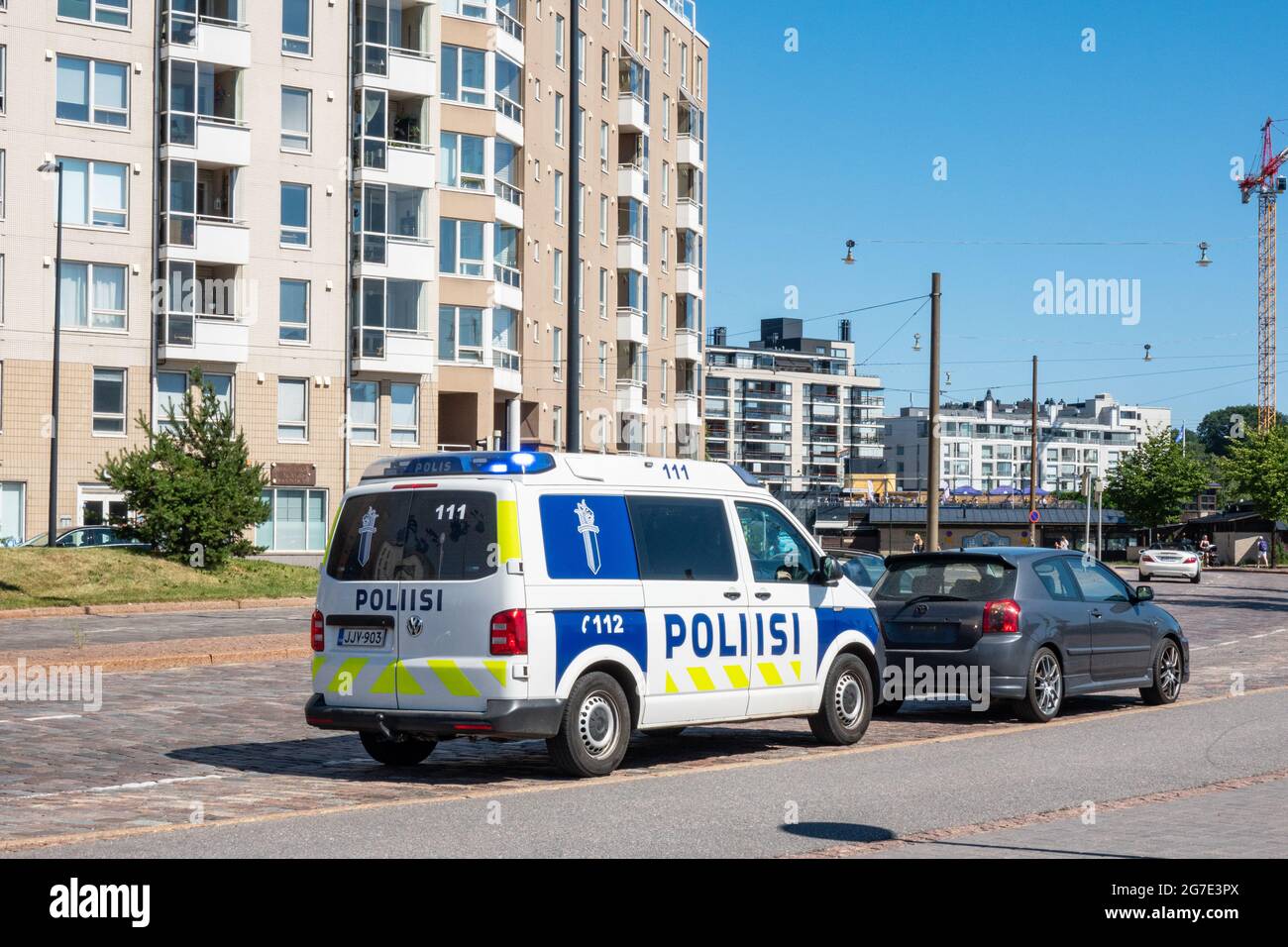 Police van has stopped a car without license plate in Hietalahti district of Helsinki, Finland Stock Photo