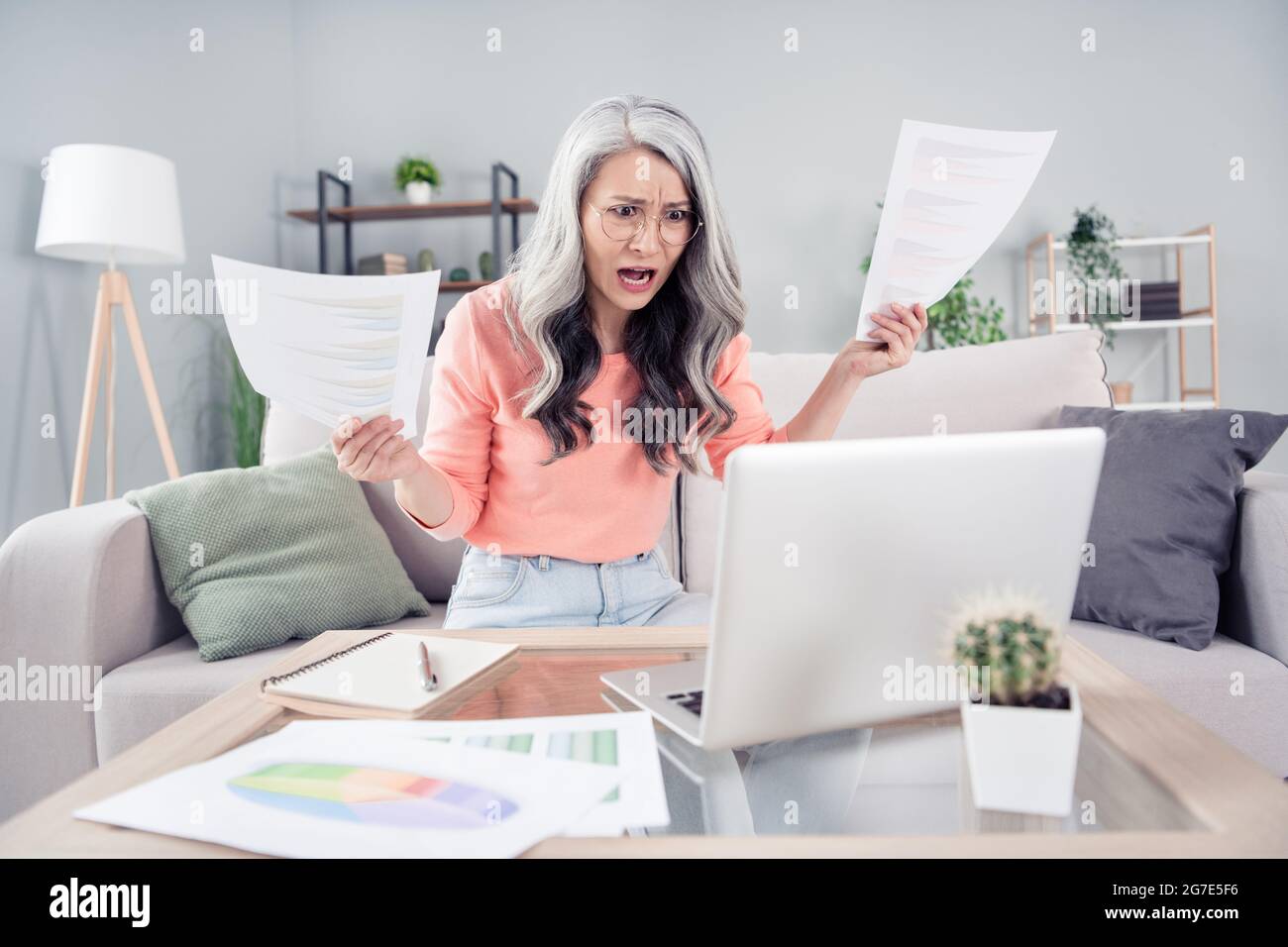 Photo of aged woman unhappy upset angry mad problem fail documents ...