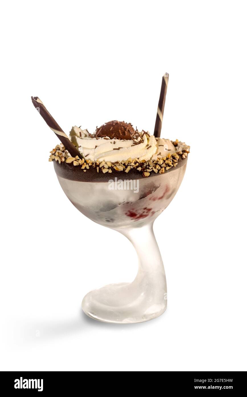 Cream flavored ice cream with chocolate and chopped hazelnuts and wafer biscuit in glass cup isolated on white, copy space Stock Photo
