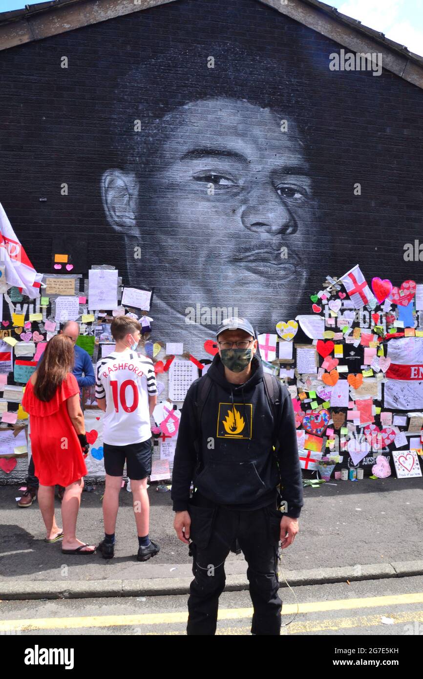 Close up of a small part of the giant Manchester United player Marcus  Rashford mural in Withington, Manchester, England, United Kingdom, that was  vandalised with abusive graffiti after England's Euro2020 football loss