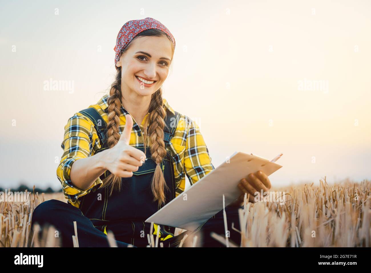 Successful farmer having harvest finished showing thumps-up Stock Photo