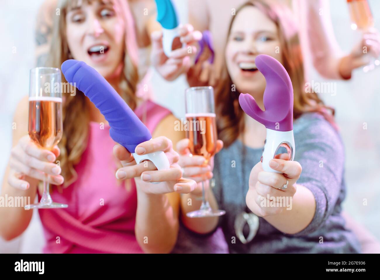 Women showing sex toys they bought at a dildo party and drinking champagne  Stock Photo - Alamy
