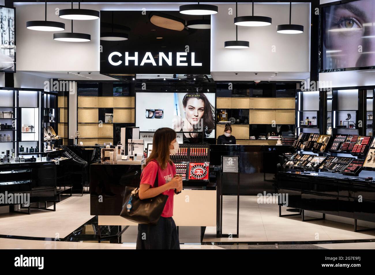 A shopper walks past the French multinational Chanel clothing and beauty  products brand store in Hong Kong Stock Photo - Alamy
