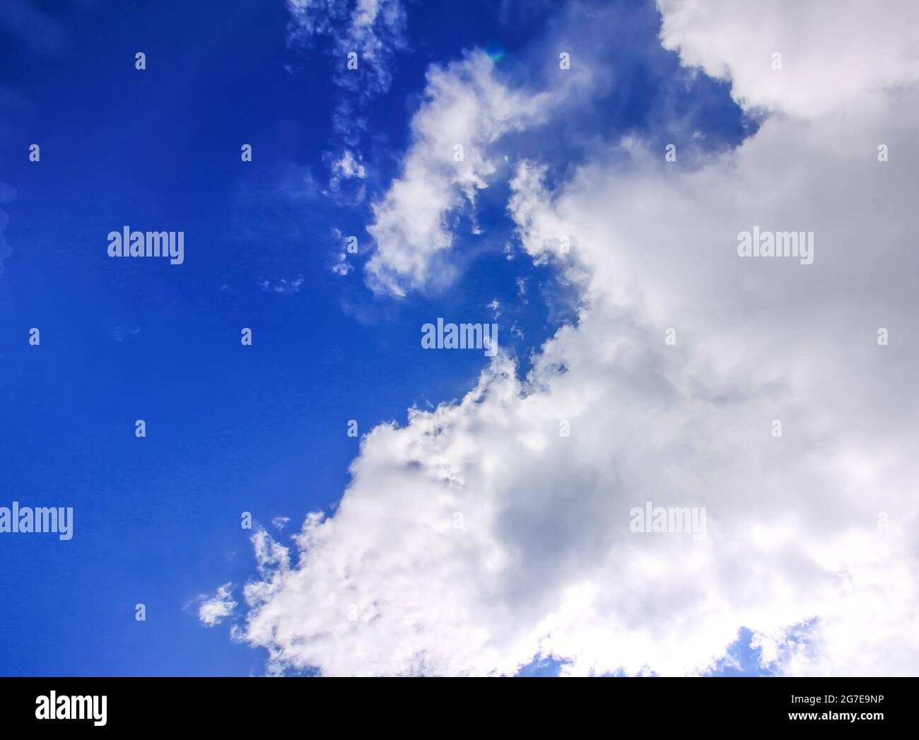 Blue sky with white clouds in sunny summer day Stock Photo - Alamy