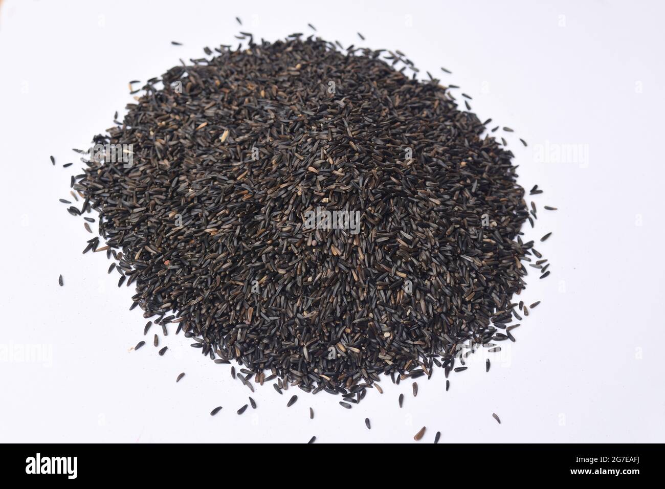 pile of Guizotia abyssinica. Niger seeds on white background Stock Photo