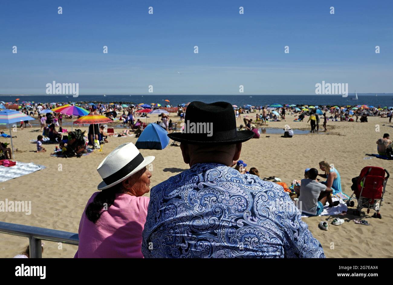 People at Coney Island beach during an hot summer's sunday afternoon, in New York City. Stock Photo