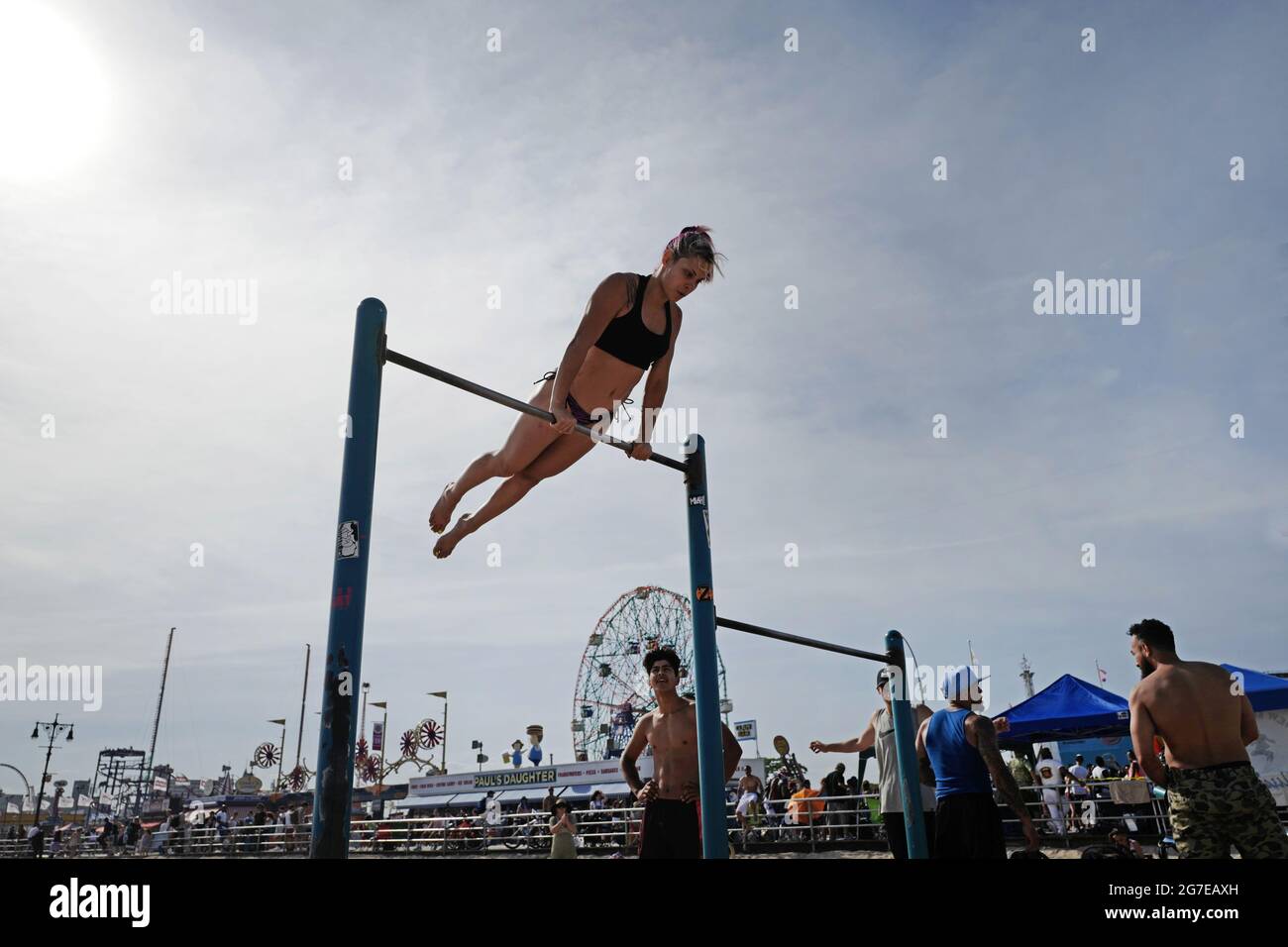 Beach fitness on Coney Island during an hot summer's sunday afternoon, in New York City. Stock Photo