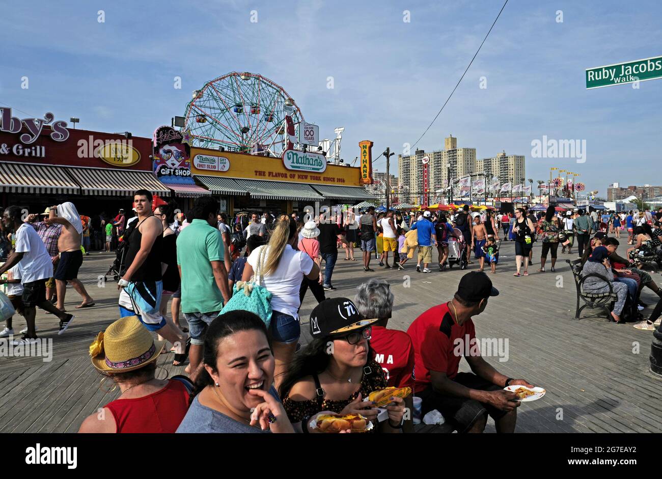 People on Coney Island boardwalk, during an hot summer's sunday afternoon, in New York City. Stock Photo
