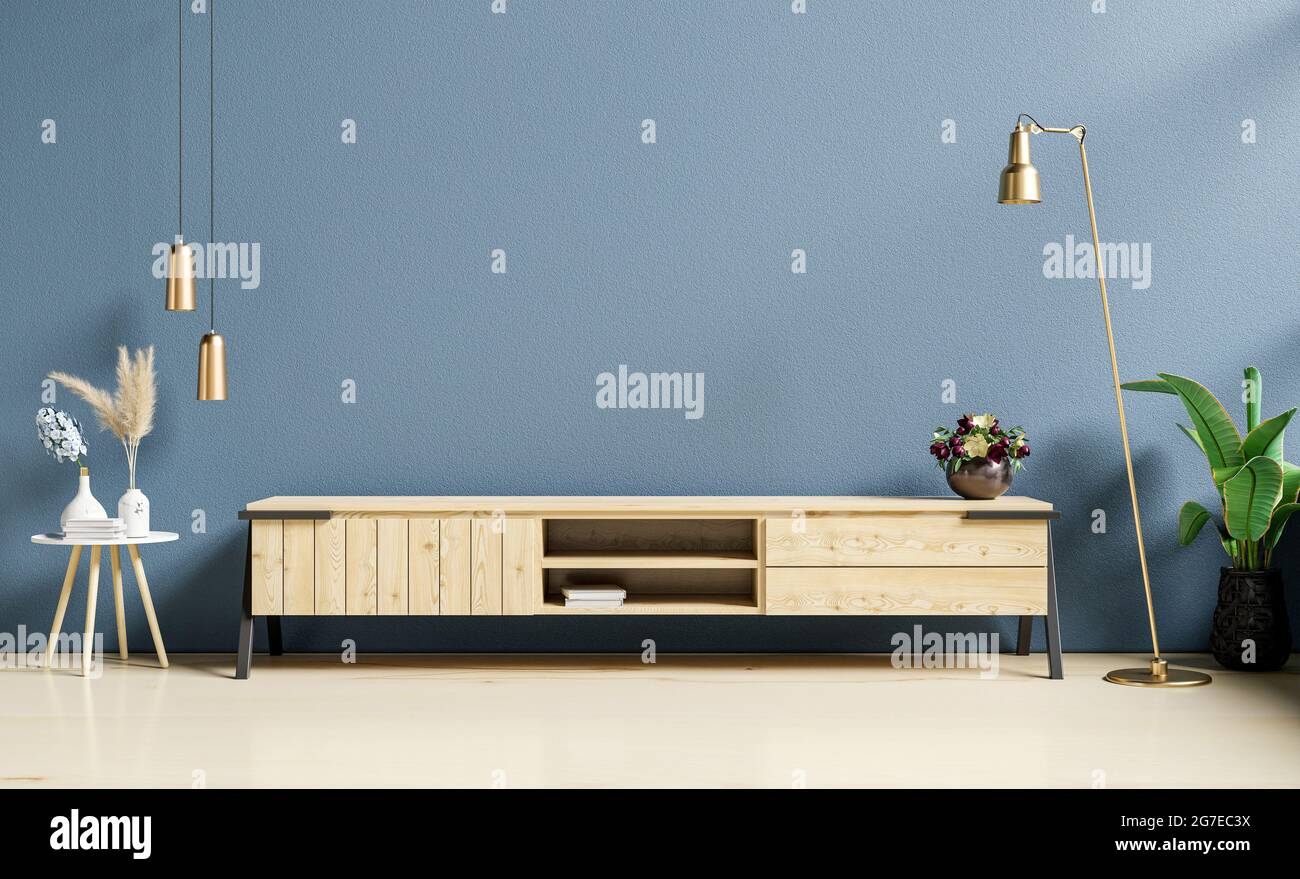 Modern interior of living room with cabinet for tv on dark blue wall ...