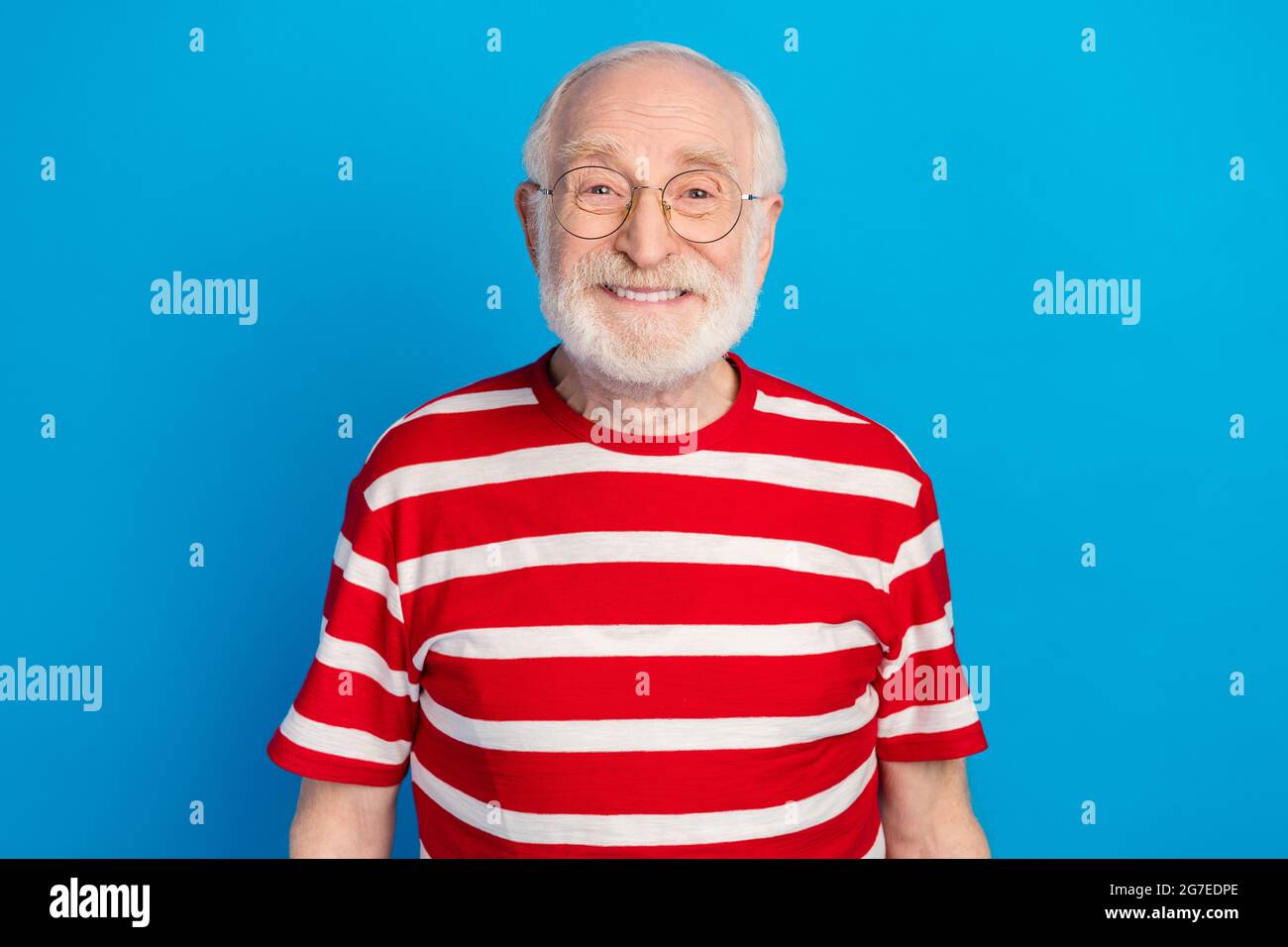 Portrait Of Attractive Content Cheerful Grey haired Man Wearing Specs
