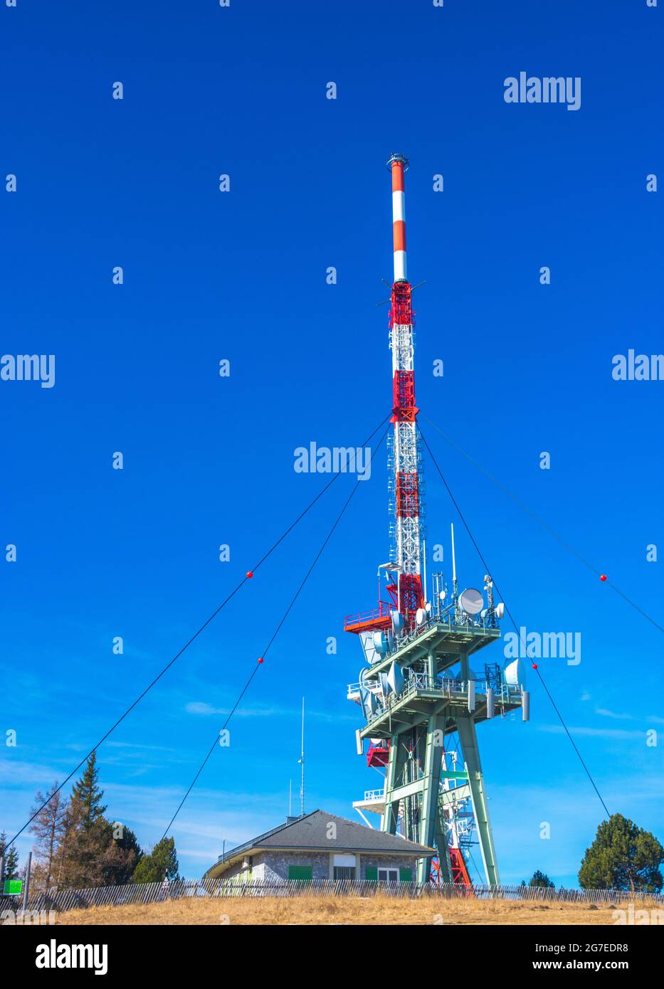 Telecommunication tower with directional mobile phone and internet antennas on Schockl Mountain in St. Radegund, near Graz, Austria. Wireless communic Stock Photo