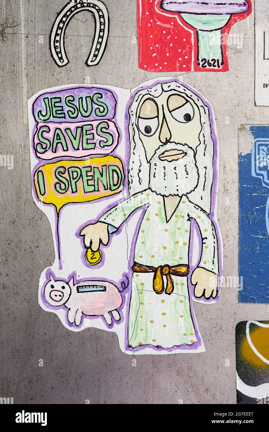 Jesus saves I spend sticker Stock Photo