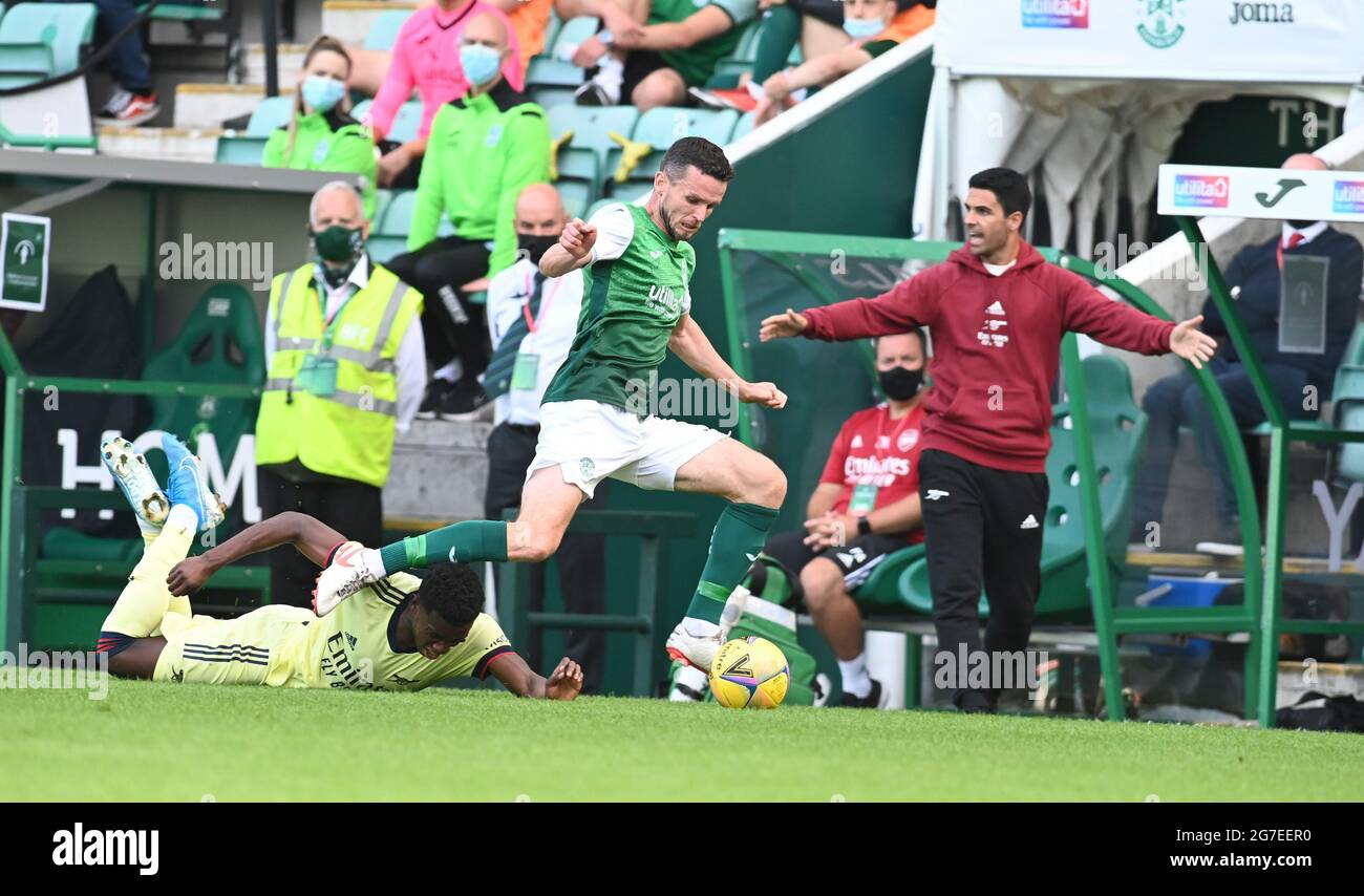 Easter Road Stadium .Edinburgh .Scotland. UK .13th July 21 Hibernian vs Arsenal Pre Season friendly match . Hibs Paul McGinn takes outs Eddie Nketiah Arsenal Credit: eric mccowat/Alamy Live News Stock Photo