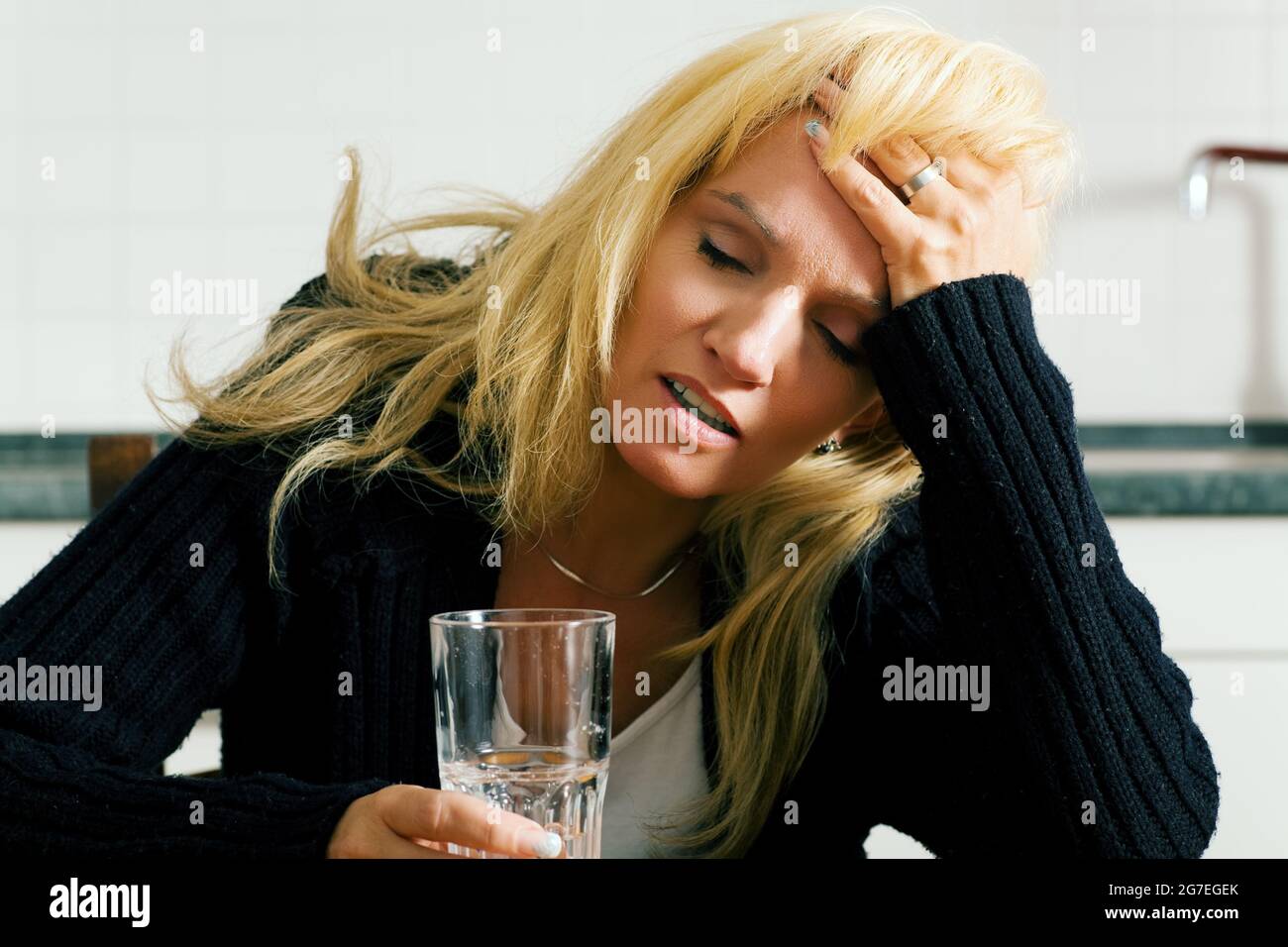 Very depressed, sad or grumpy looking woman having headache with a ...