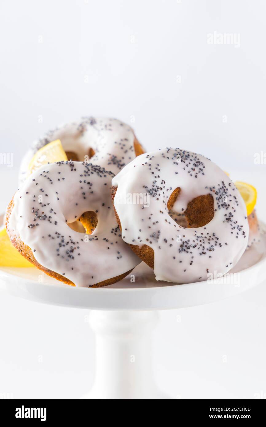 Glazed Lemon Poppy Seed Doughnuts Stock Photo Alamy