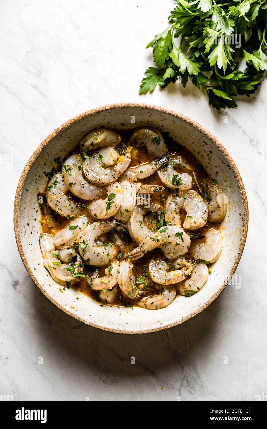 Shrimp in a homemade marinade, on a marble background Stock Photo