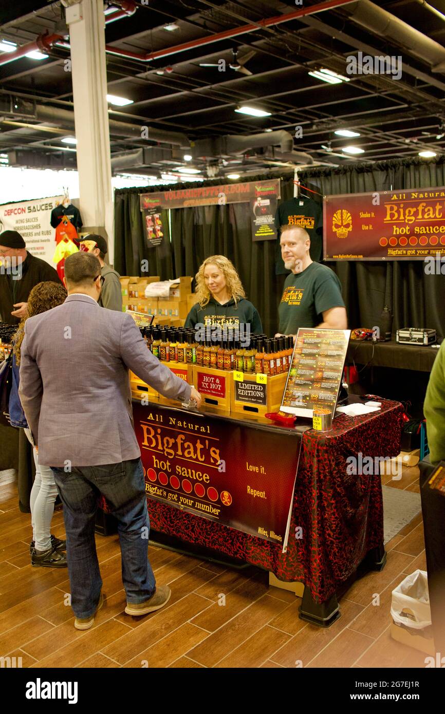 The NYC Hot Sauce Expo 2017 was held at the Brooklyn Expo Center.  Lots of Hot Sauce vendors share samples of their products. Stock Photo