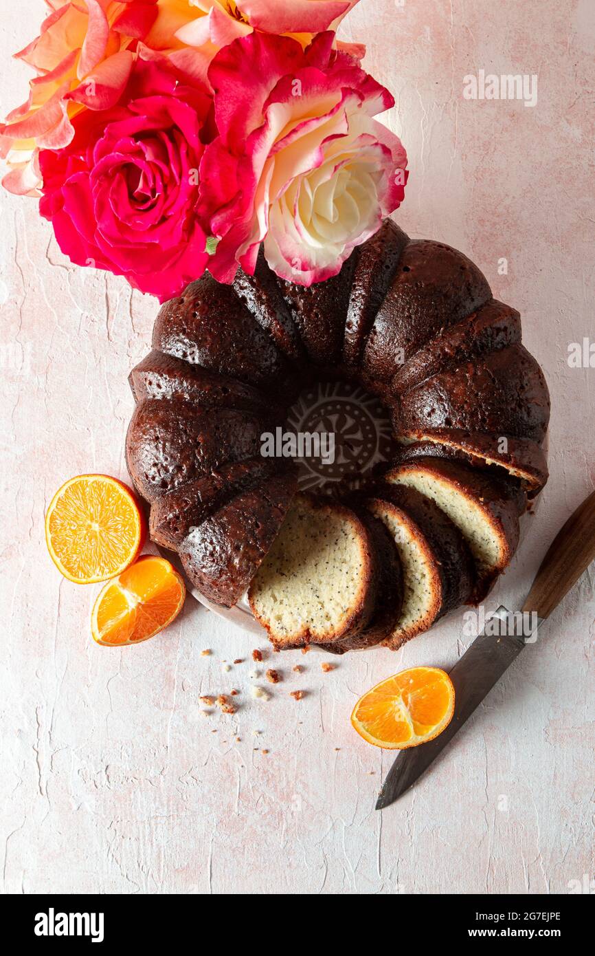 Almond Orange Poppy Seed Bundt Cake with roses Stock Photo Alamy