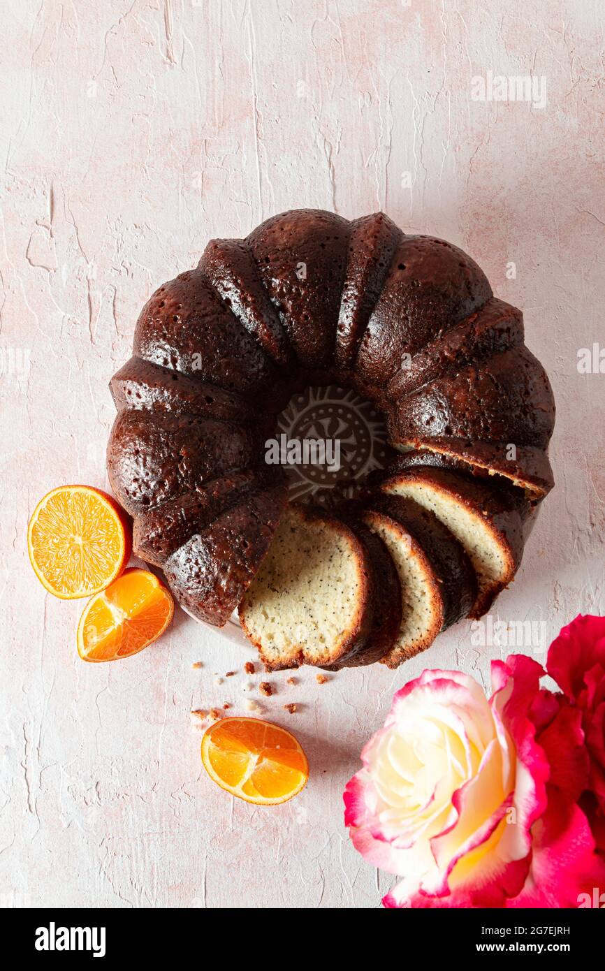 Almond Orange Poppy Seed Bundt Cake with roses Stock Photo Alamy