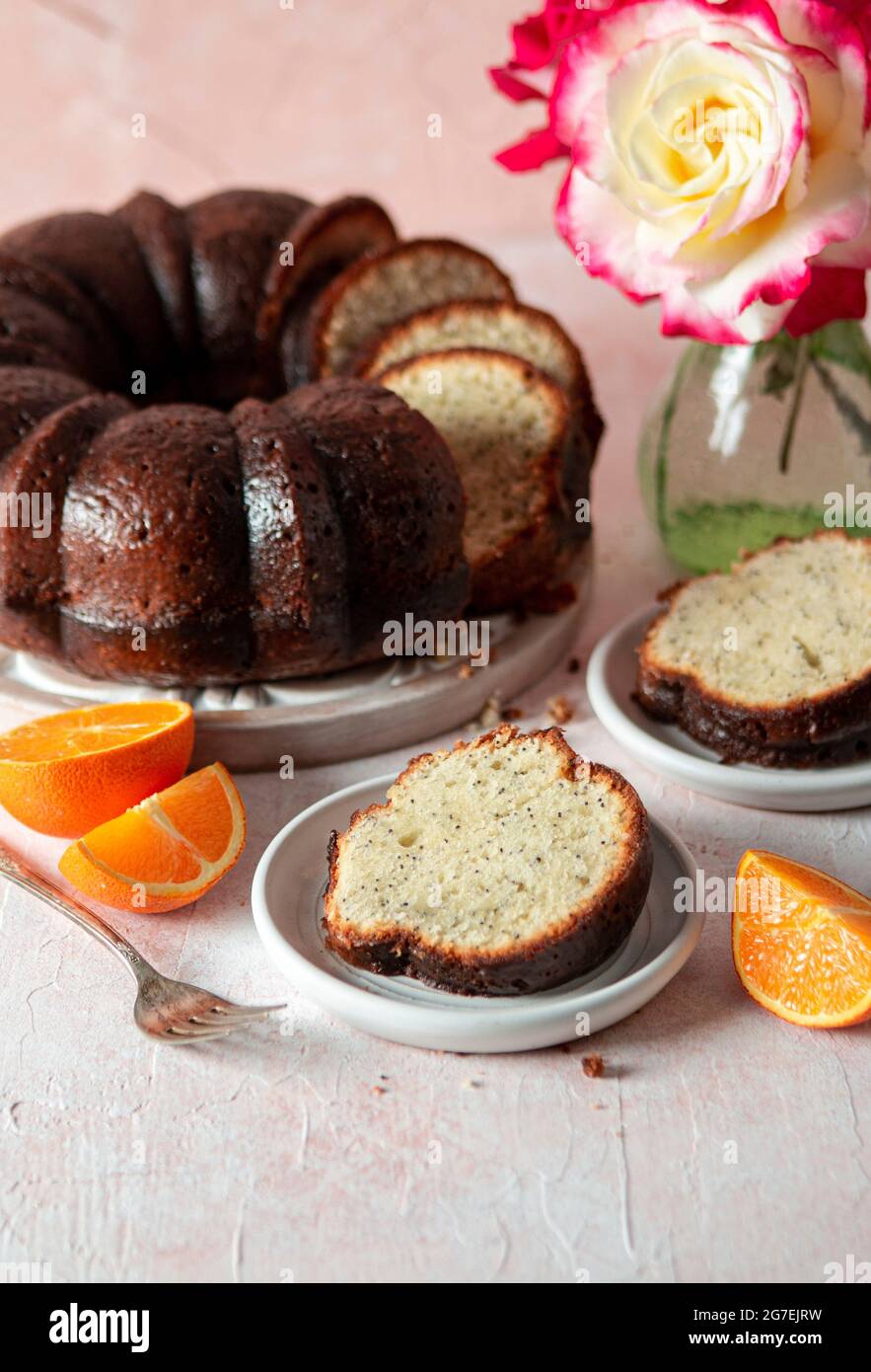 Almond Orange Poppy Seed Bundt Cake with roses Stock Photo Alamy