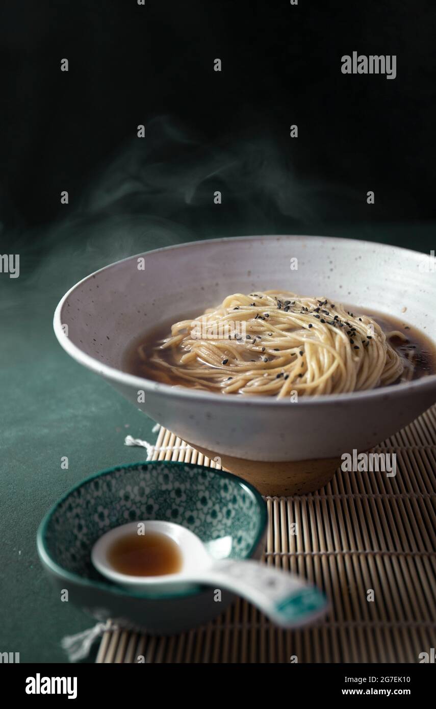 Hot japanese noodles ramen with broth dash or dashi and sesame Stock