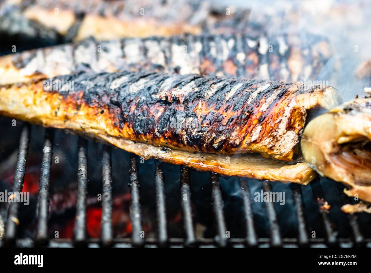 Fish being grilled on a charcoal grill Stock Photo Alamy