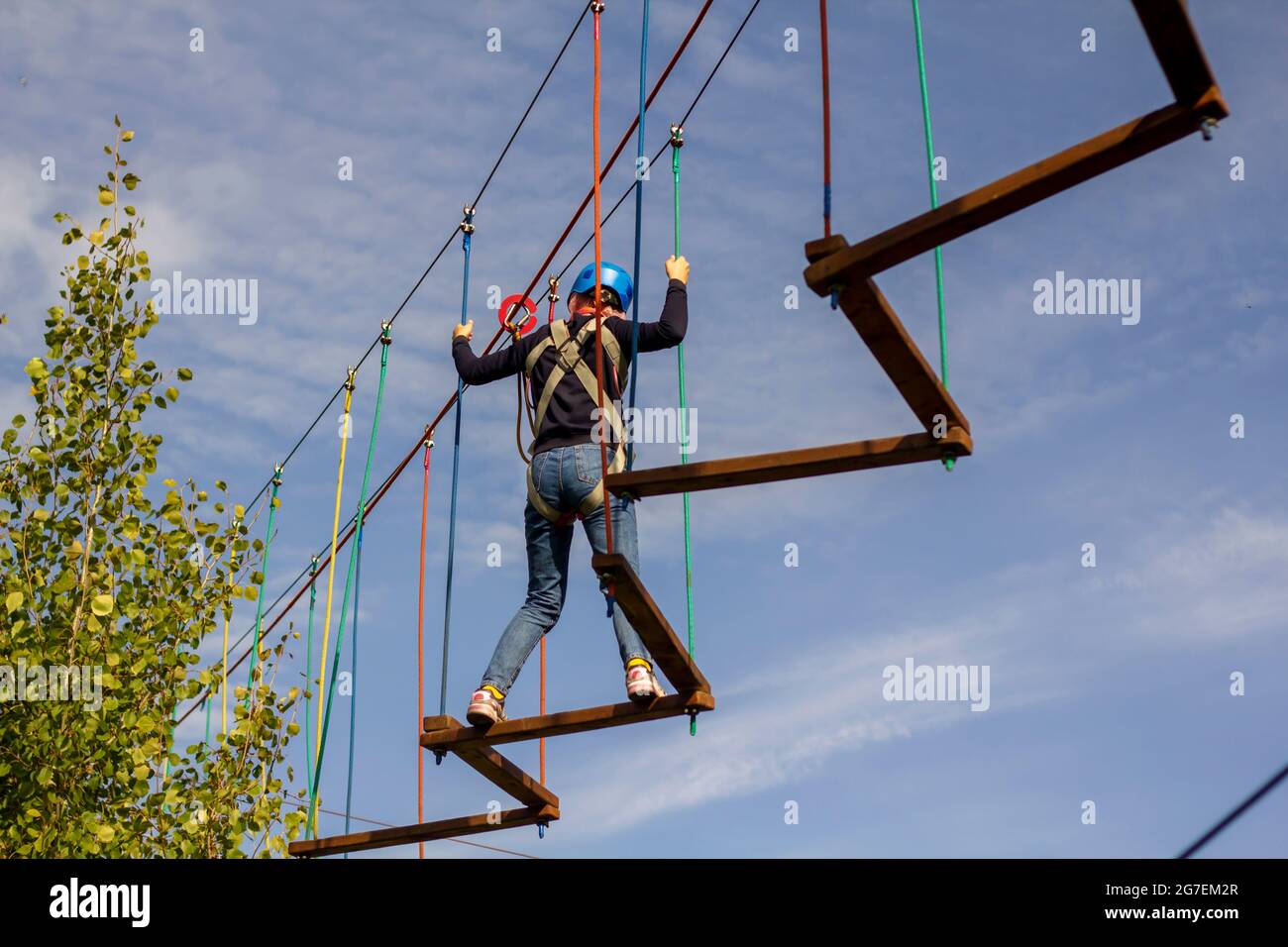 The girl is being trained in mountaineering at special children's courses. The concept of the development of sports for children and youth. Stock Photo