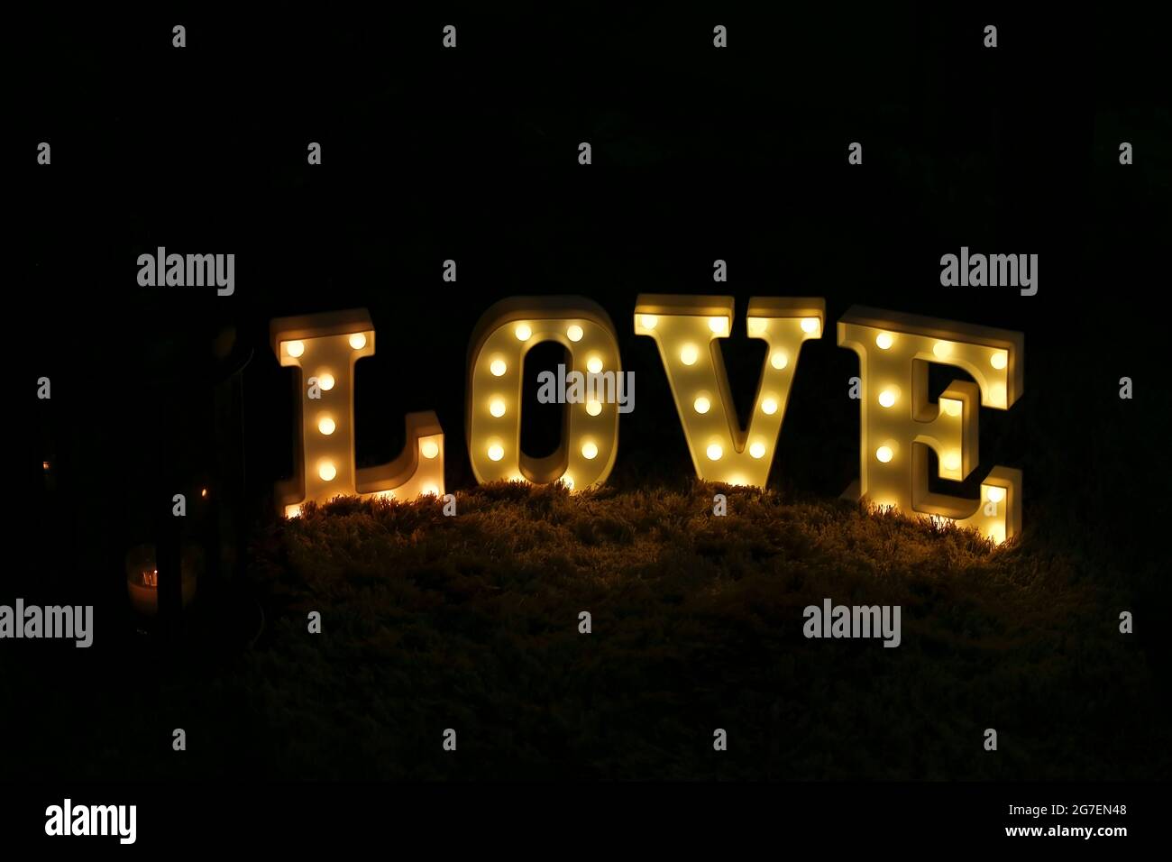 letters gathered and lit forming the word LOVE Stock Photo - Alamy