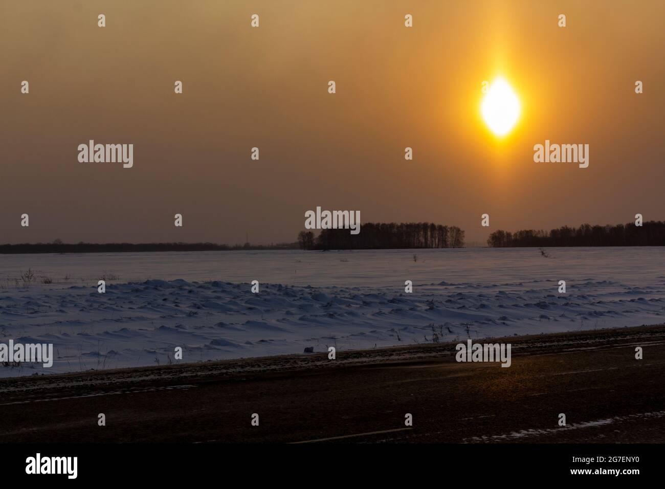 Sunrise before the appearance of the optical halo effect. The concept of studying the environment. Stock Photo