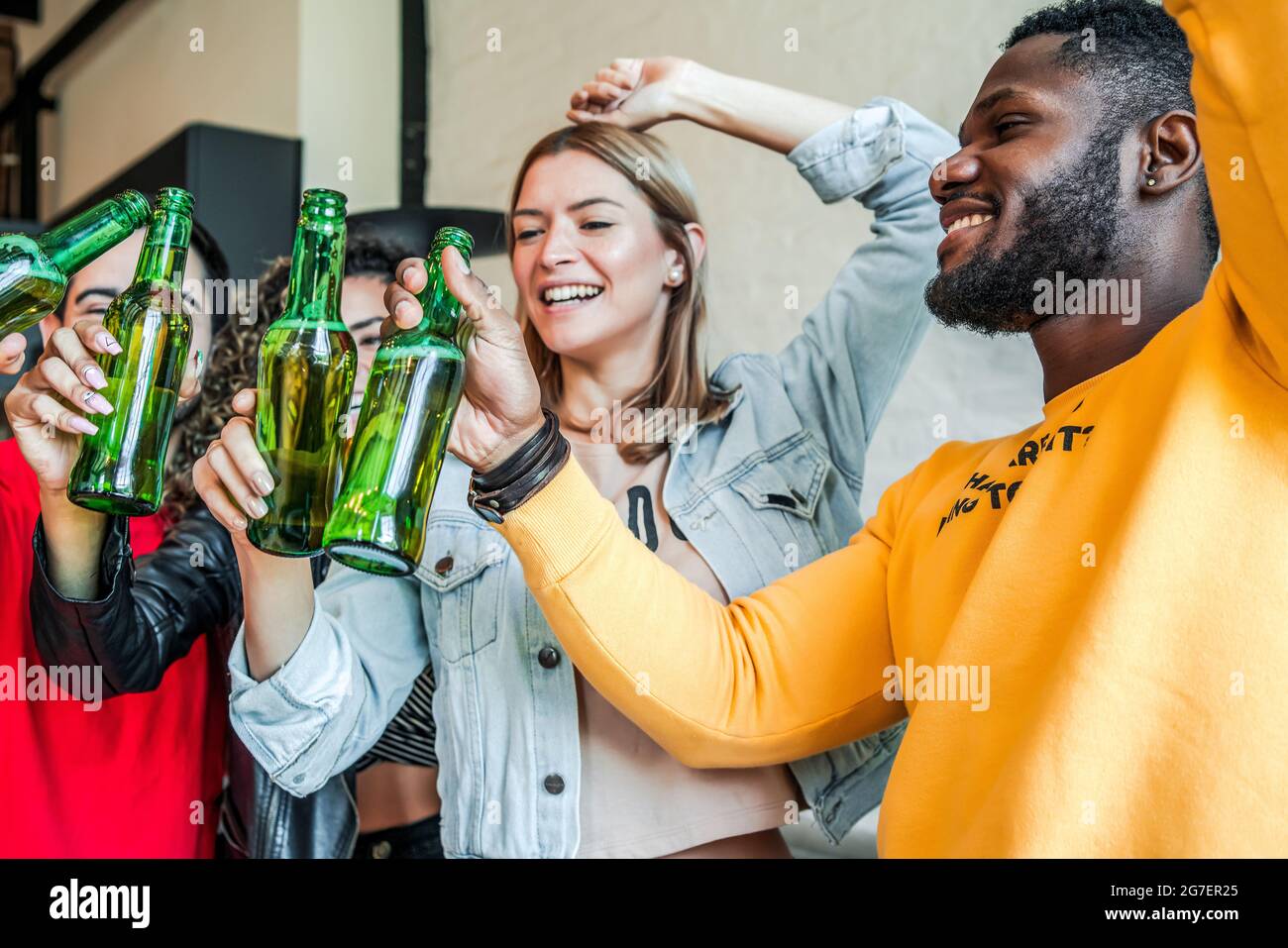 Friends having fun while drinking beer together. Stock Photo