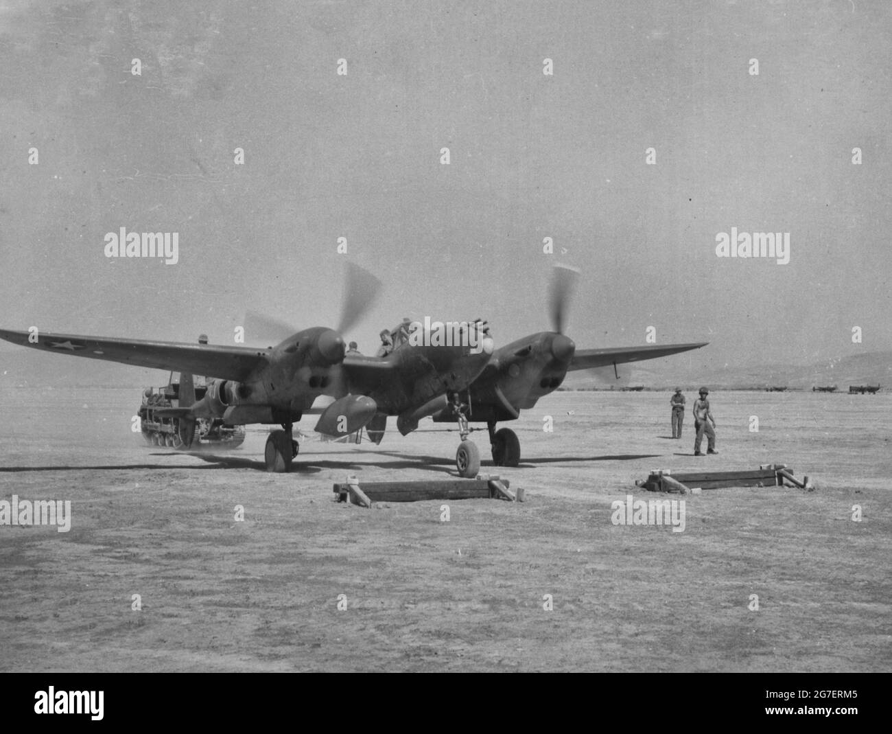 A P-38 Lightning moves up to a compass stop to get a good reading during World War II Stock Photo