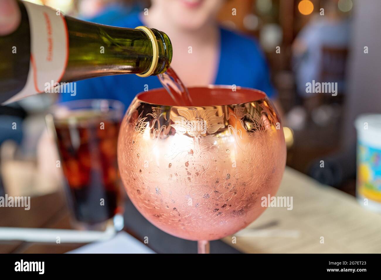 Closeup of a champagne or wine cocktail in a copper class at the Coop