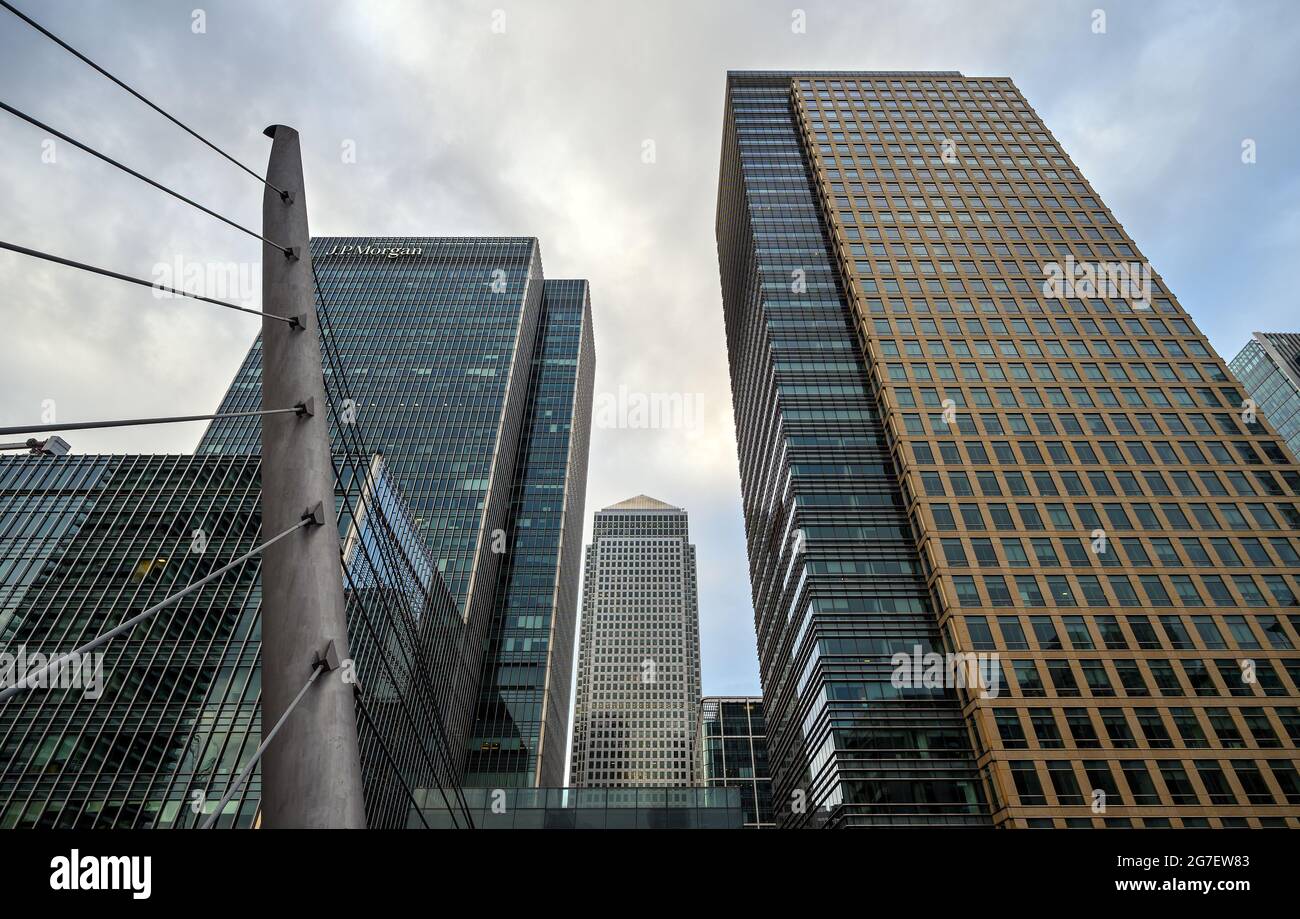 View of Canary Wharf with JP Morgan, One Canada Square and 40 Bank St buildings. Seen from the South Quay Footbridge crossing South Dock. Stock Photo