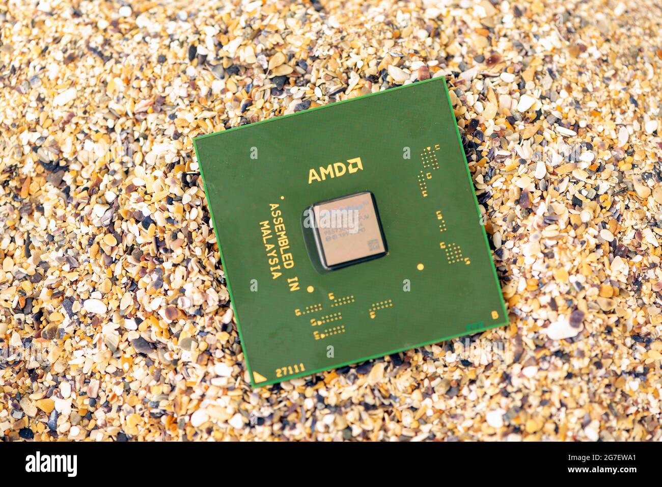 Timisoara, Romania - October 18, 2020: Close-up of an AMD Athlon XP 1800+ AX1800DMT3C processor, 1800 MHz, socket A with sand in the background. Stock Photo