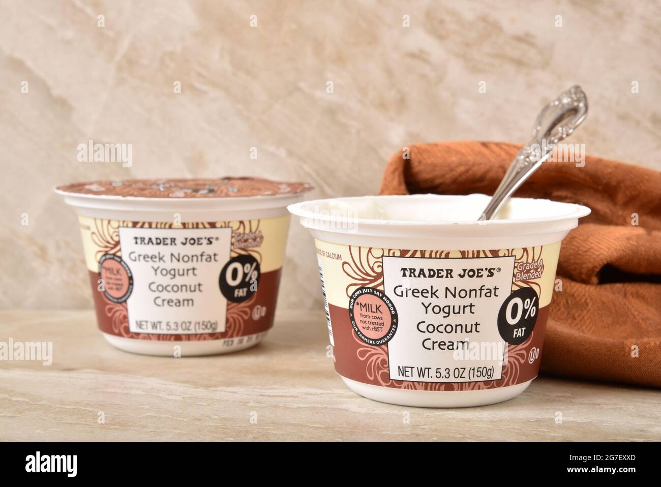 Cups of Trader Joe’s Coconut Cream Greek Non Fat Yogurt with a spoon Illustrative Editorial