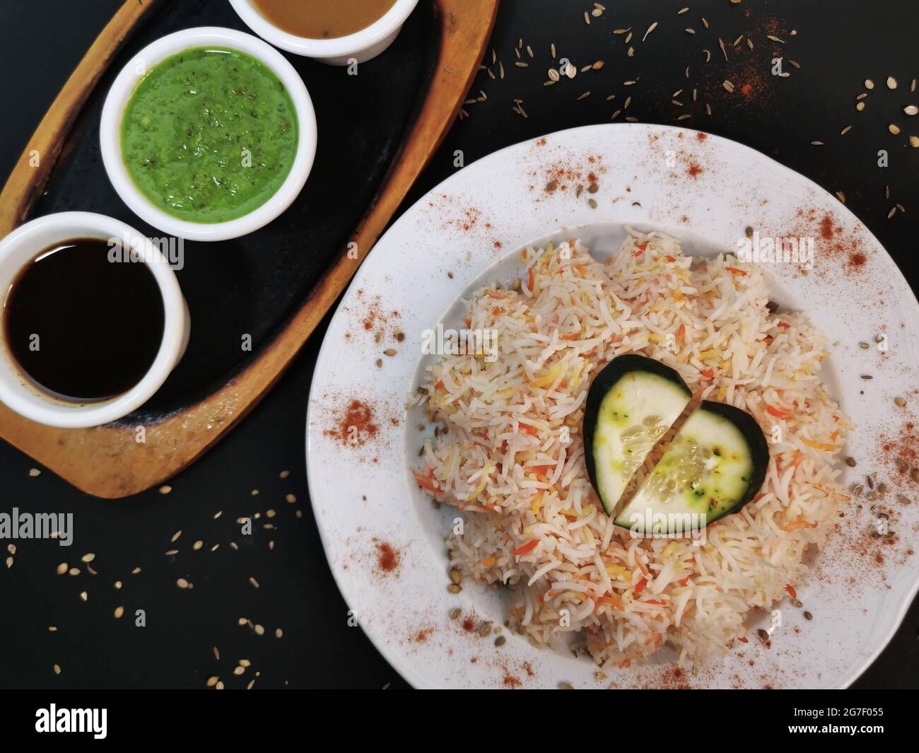 Indian rice dish with sauces Stock Photo Alamy