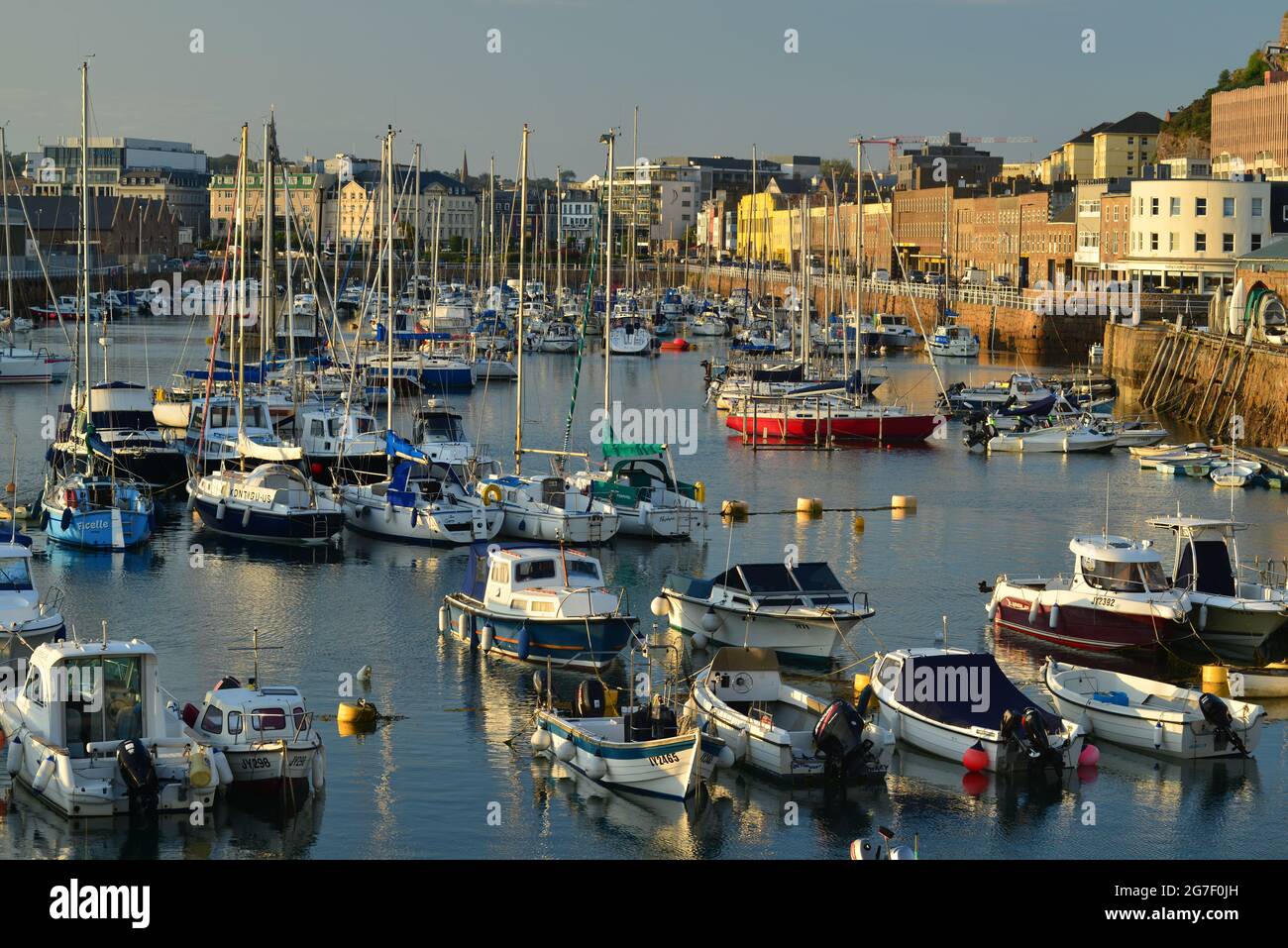 St Helier marina, Jersey, U.K. Summer view of town at high tide Stock Photo  - Alamy