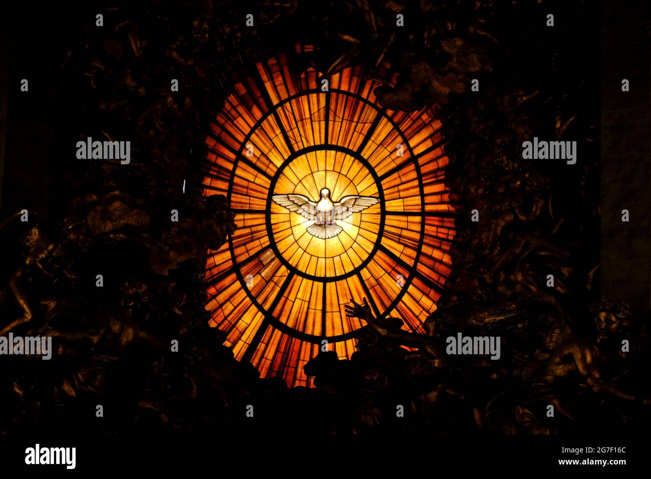 Stained glass window in St Peter's basilica: Holy spirit radiant dove symbol Stock Photo