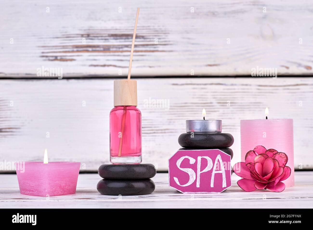 Still life spa treatment concept. Candles and stones. Stock Photo