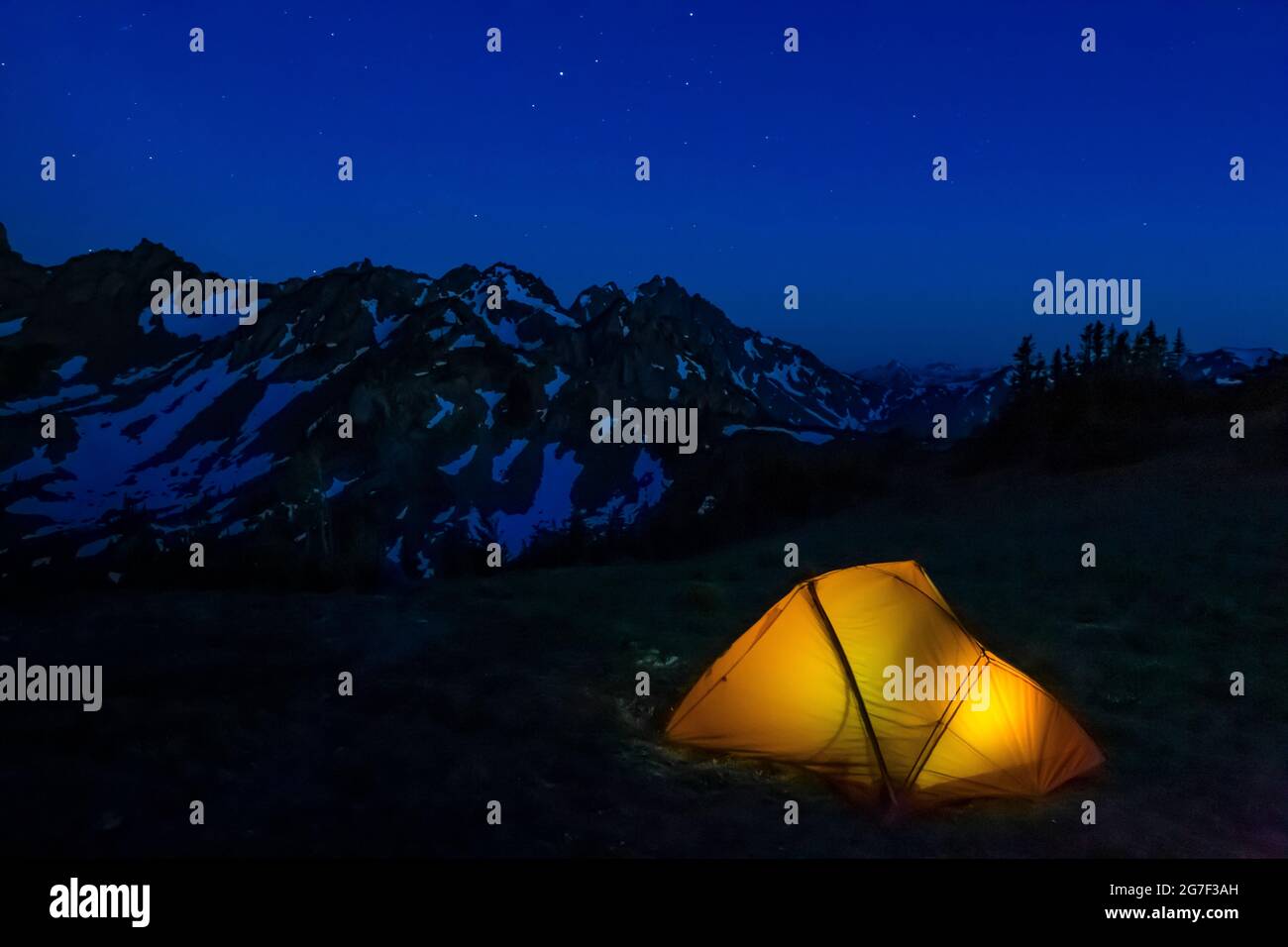 Illuminated backpacking tent at Marmot Pass in the Buckhorn Wilderness