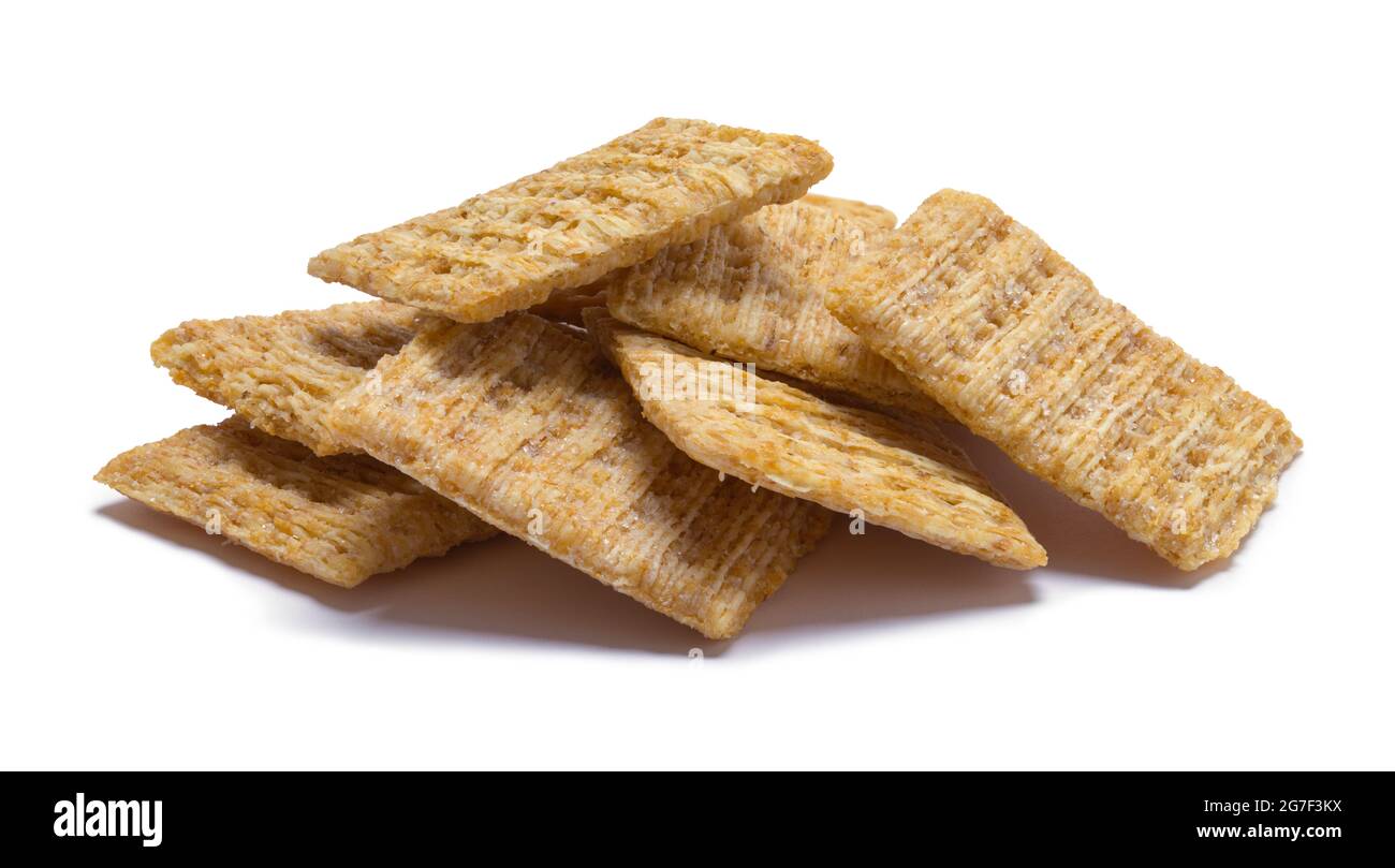 Small Pile of Shredded Wheat Crackers Cut Out on White. Stock Photo