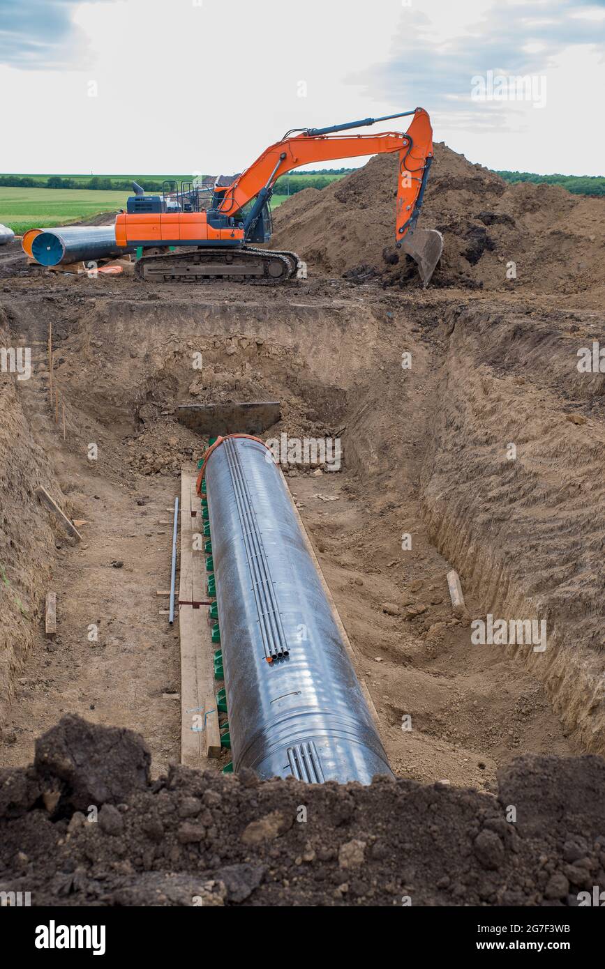 Construction works for laying the pipe. Stock Photo