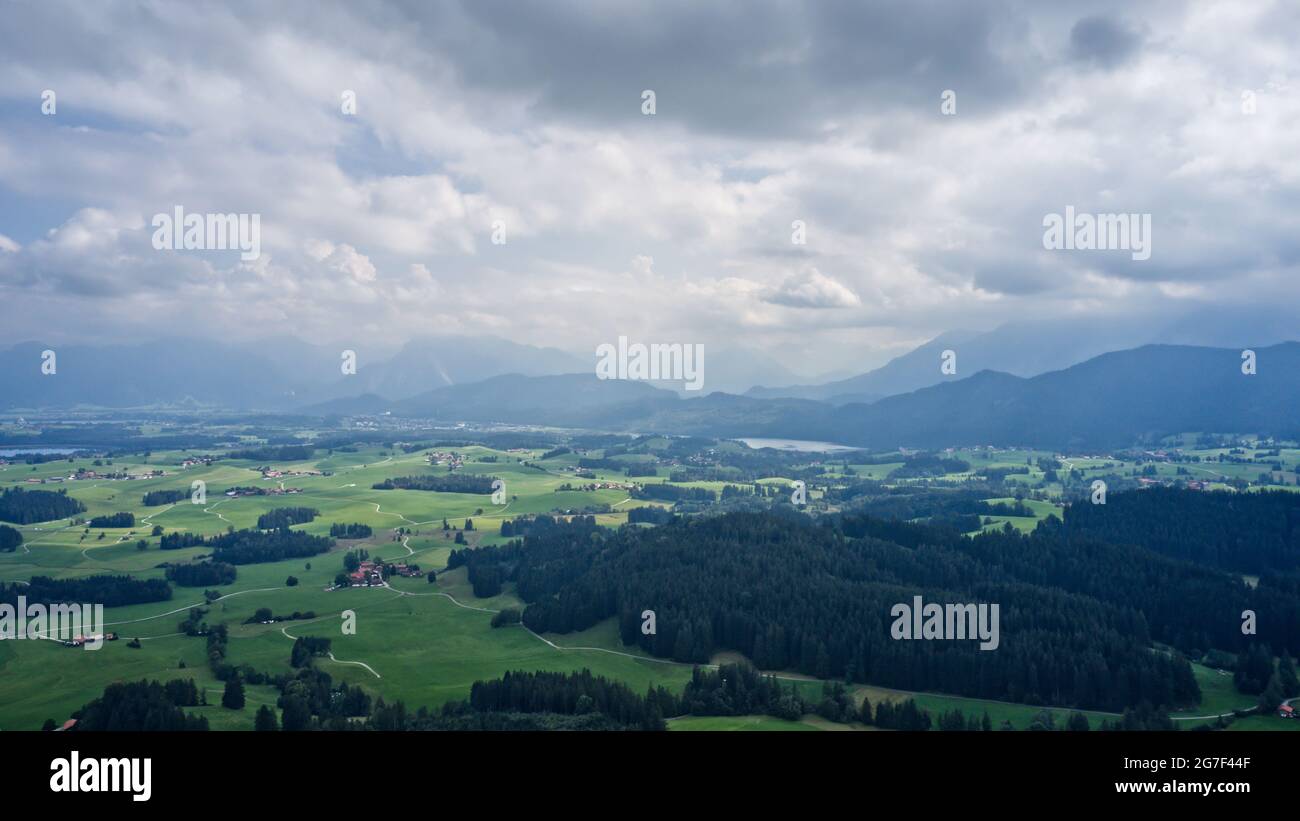 Cloudy day on in the fields surrounded by dense forests Stock Photo - Alamy