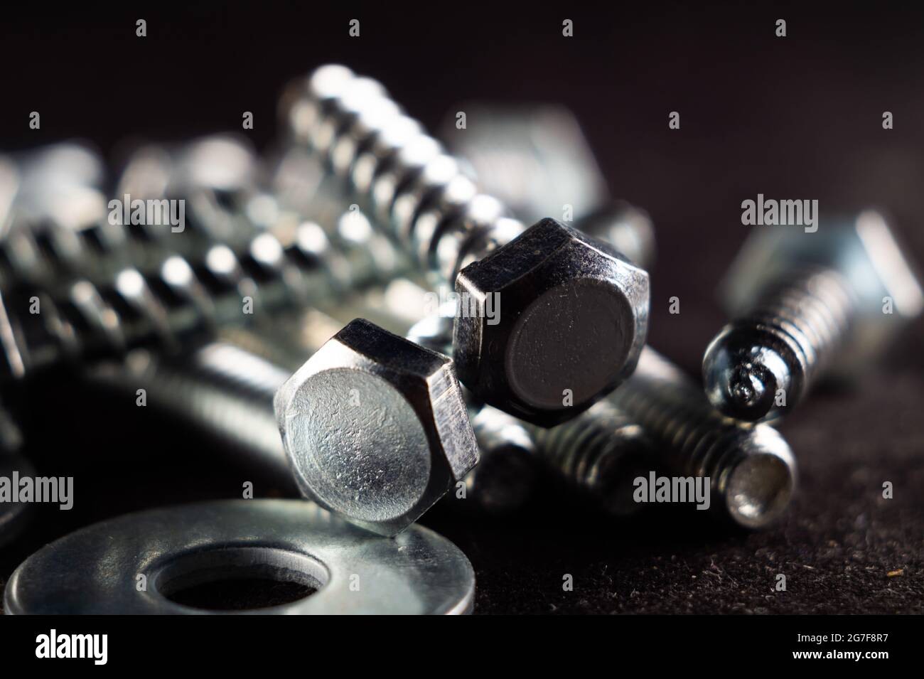 Closeup photo of a set of fasteners on a black surface Stock Photo Alamy